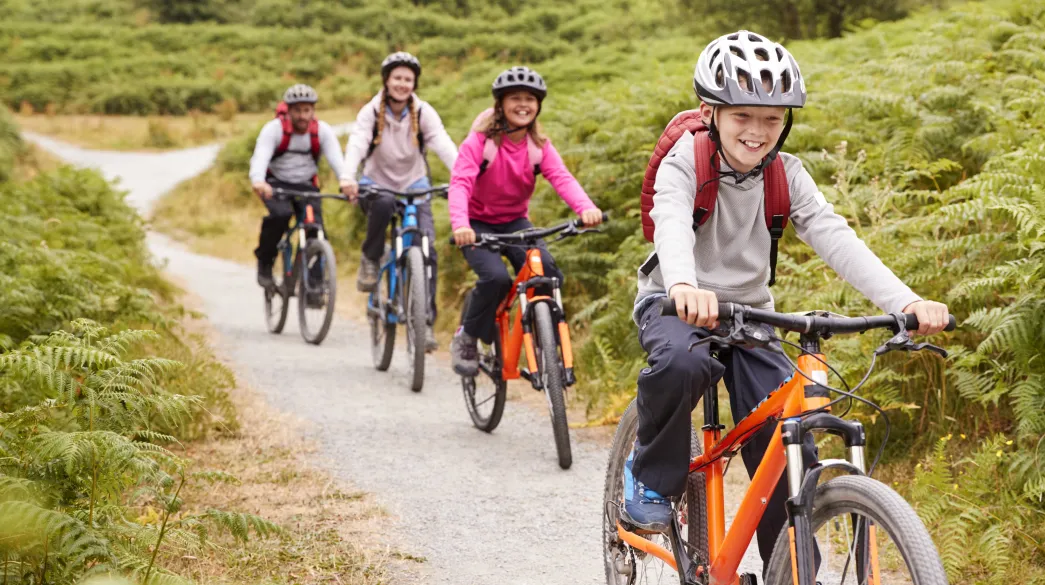 Family cycling on country lanes