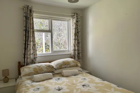 A double bedroom inside Begonia Cottage at Spreacombe Holiday Cottages