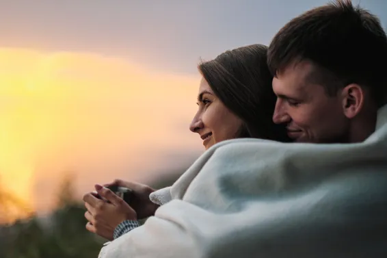 Couple relaxing enjoying a sunset