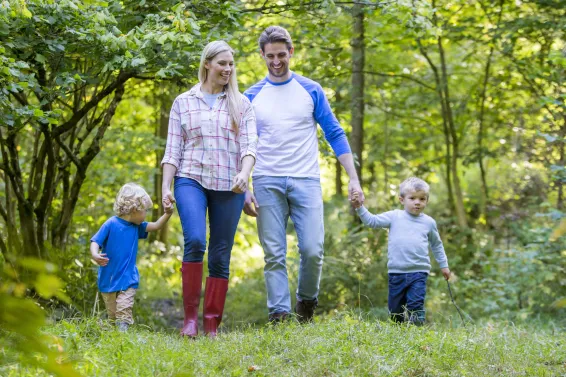 Family out for a walk in the countryside whilst on holiday