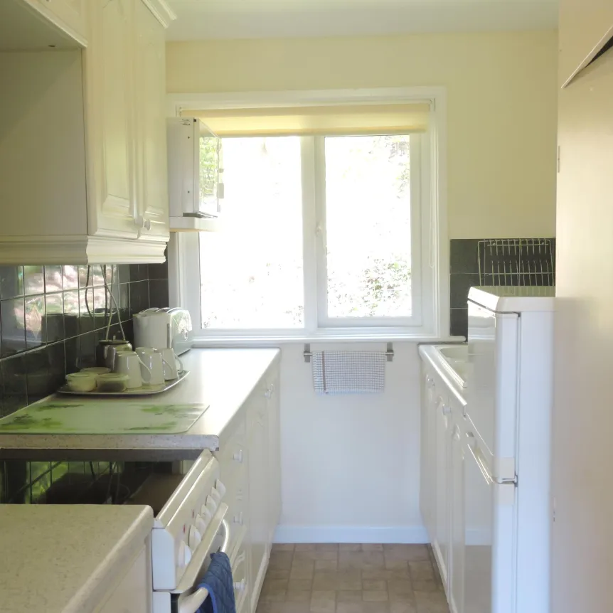 The kitchen area inside Azalea Cottage at Spreacombe Holiday Cottages