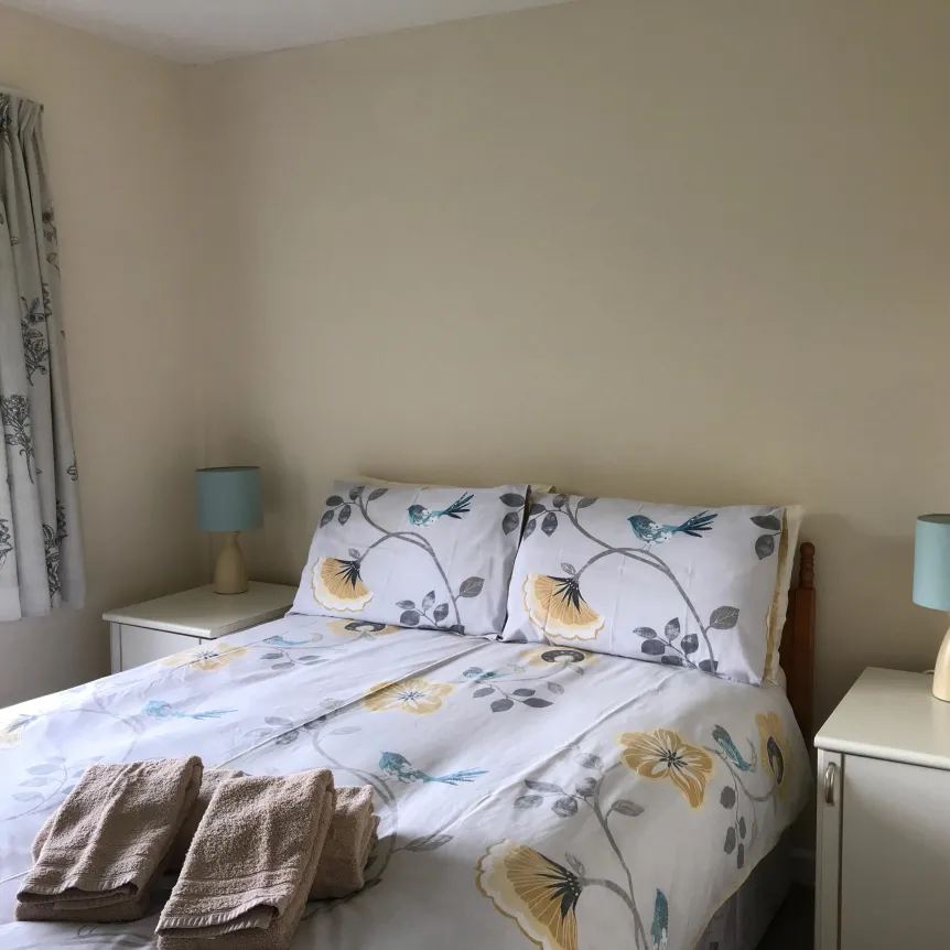 Overlooking the valley, double bedroom 1 inside Azalea Cottage at Spreacombe Holiday Cottages