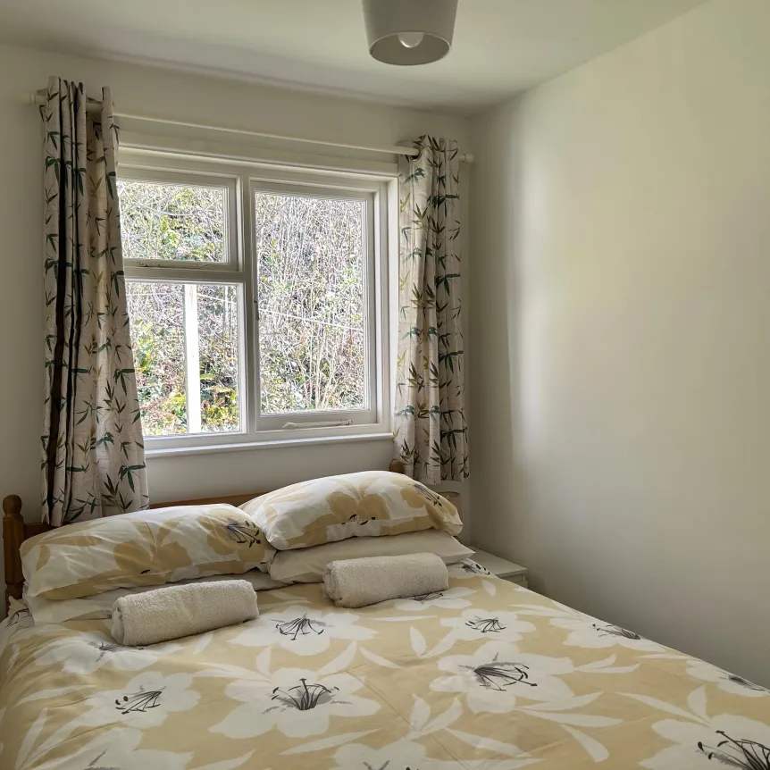 A double bedroom inside Begonia Cottage at Spreacombe Holiday Cottages