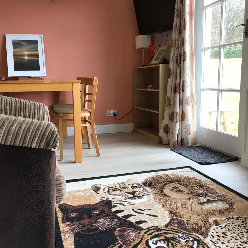 The lounge and dining area inside Begonia Cottage at Spreacombe Holiday Cottages