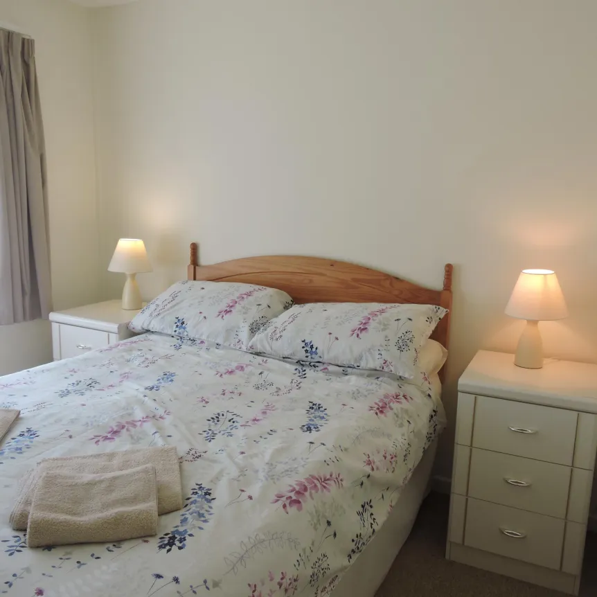 A double bedroom inside Camellia Cottage at Spreacombe Holiday Cottages