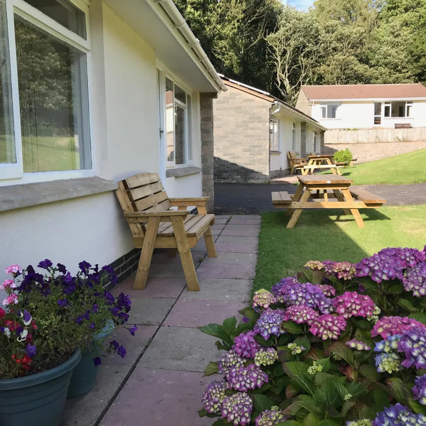 The lawns and gardens outside Camellia Cottage at Spreacombe Holiday Cottages