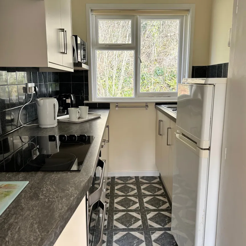 The kitchen inside Camellia Cottage at Spreacombe Holiday Cottages