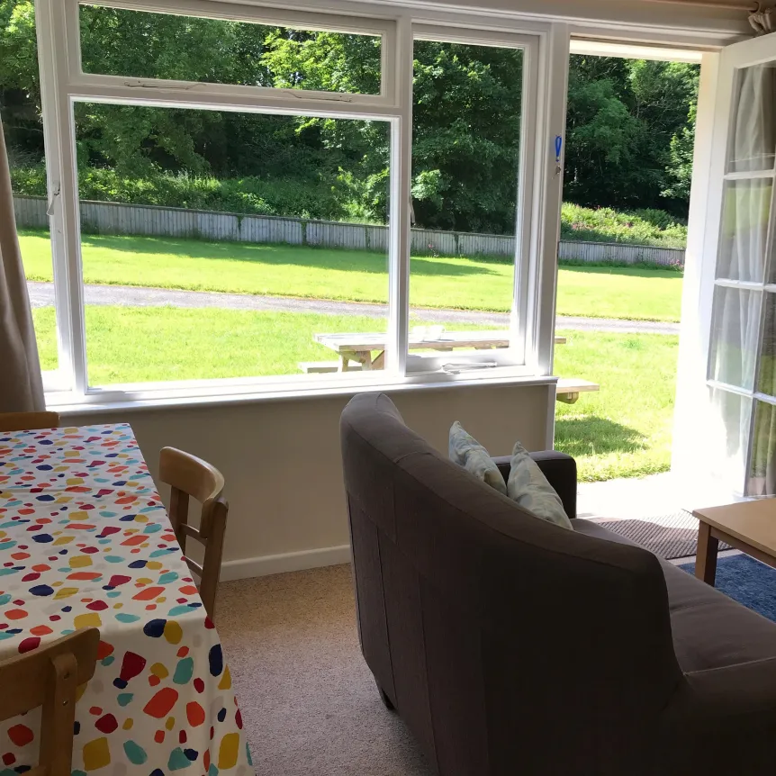 A view of the lawns in from of Camellia Cottage from the lounge windows at Spreacombe Holiday Coattges