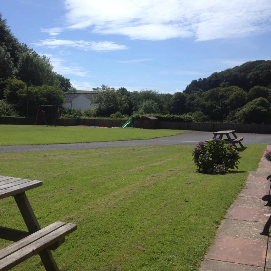 The lawns at Spreacombe Holiday Cottages outside of Camellia Cottage
