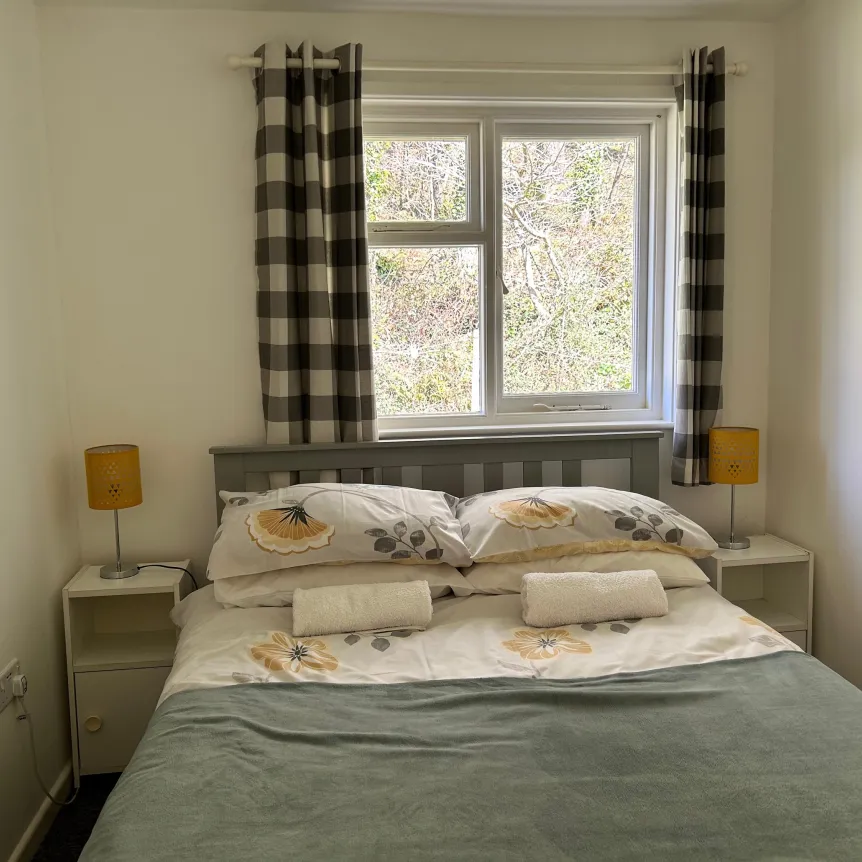 A double bedroom inside Hibiscus Cottage at Spreacombe Holiday Cottages