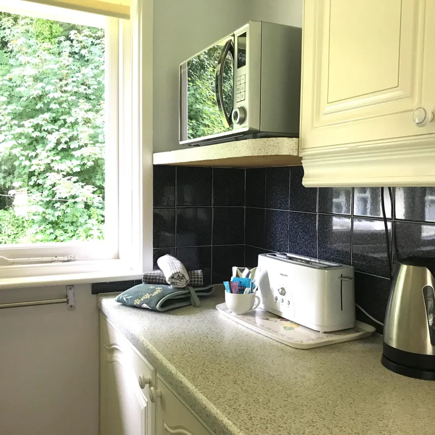 The kitchen inside Hibiscus Cottage at Spreacombe Holiday Cottages