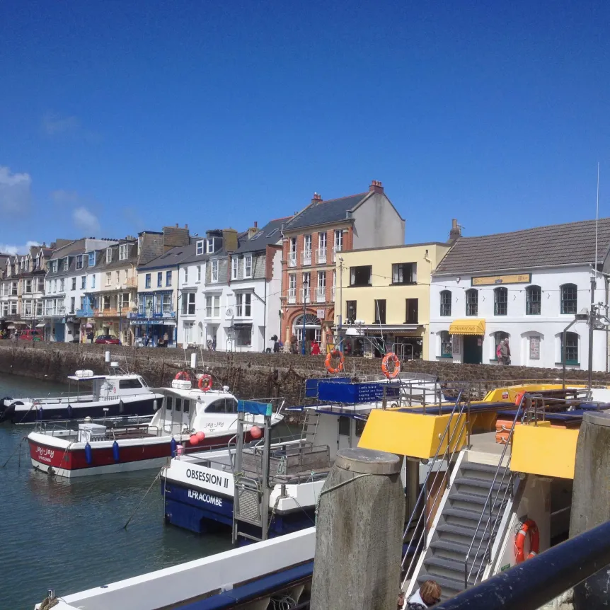 Boats and buildings lining the harbour at Ilfracombe
