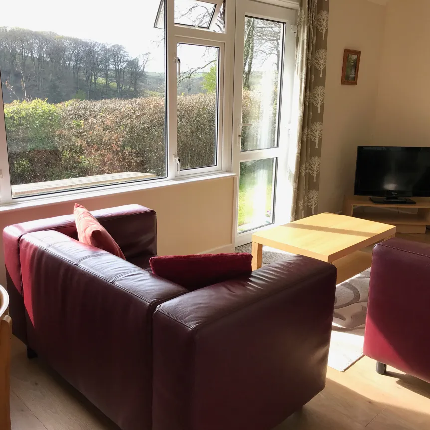The lounge inside Fuchsia Cottage at Spreacombe Holiday Cottages