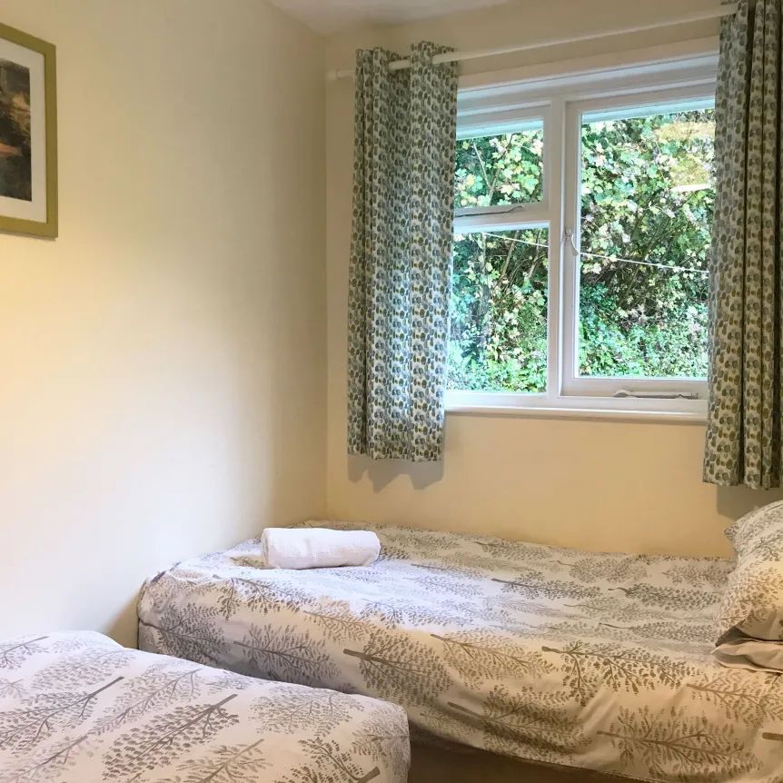 The twin bedroom inside Fuchsia Cottage at Spreacombe Holiday Cottages