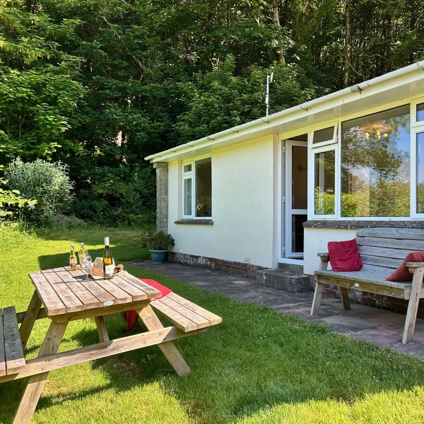 Outside Fuchsia showing picnic table and bench