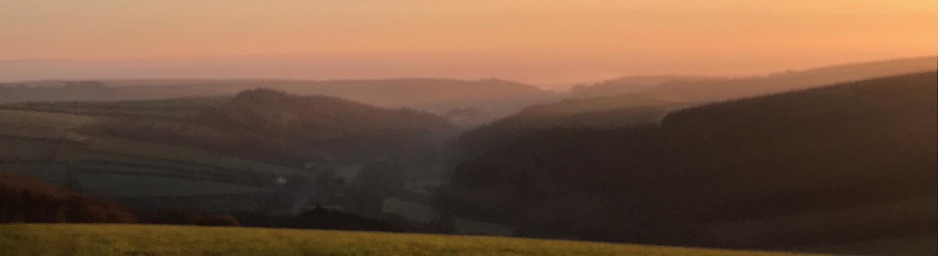 View looking over the hills of Spreacombe at sunset