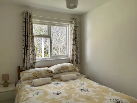 A double bedroom inside Begonia Cottage at Spreacombe Holiday Cottages