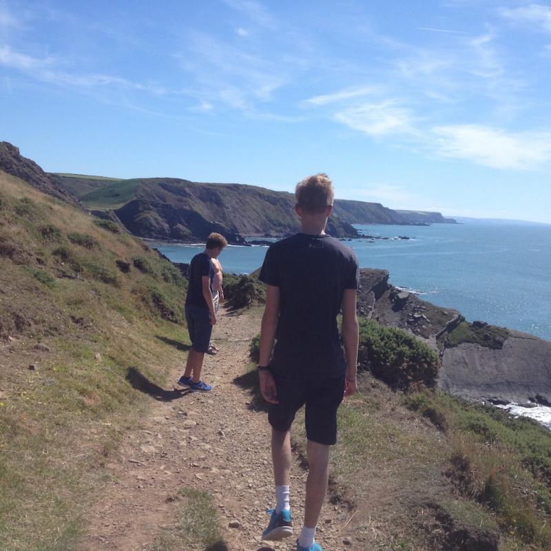 Walkers on one of the stunning South West Cliff Paths, the nearest of which is about 10 mins drive from Spreacombe