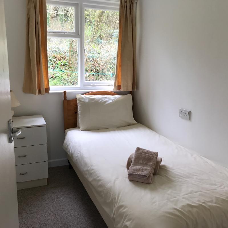 Singe bedroom with woodland view