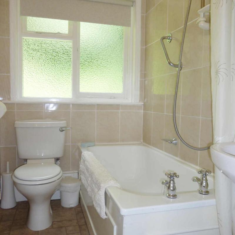 Bathroom showing Bath with shower at Spreacombe