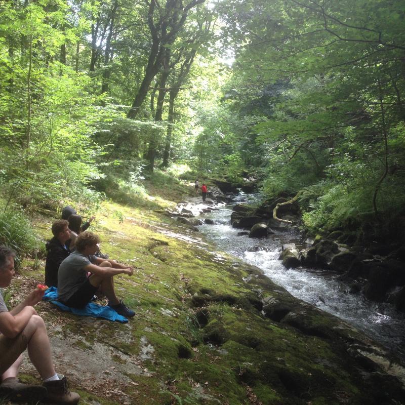 Family having lunch by the river near to Watersmeet