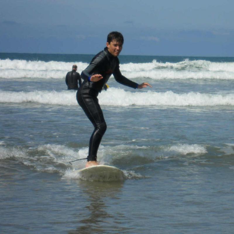 Boy having surfing lesson at Saunton