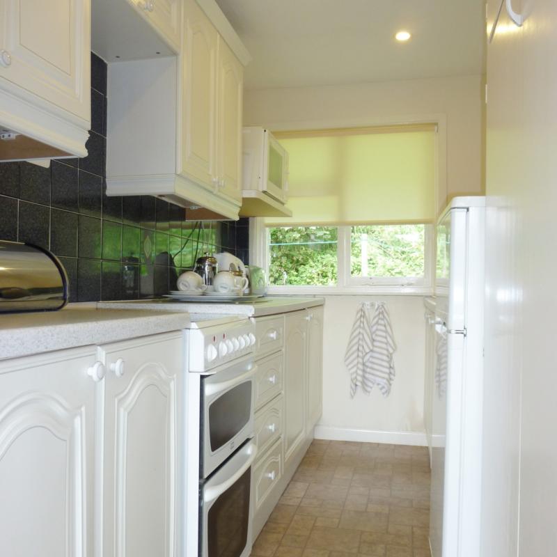 well equipped kitchen backing onto woodland